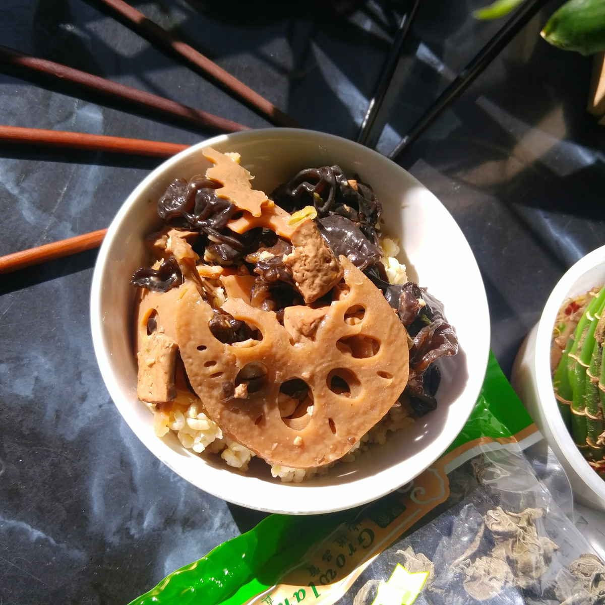 Lotus root wood ear mushroom tofu stir fry in a bowl ready to eat