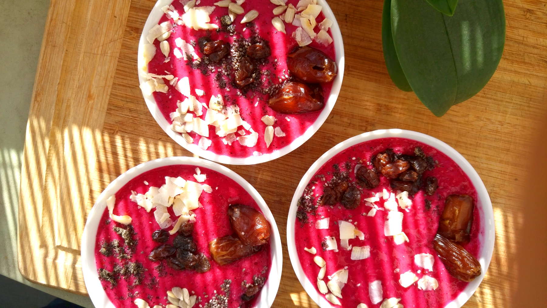 3 dragon fruit smoothie bowls with toppings