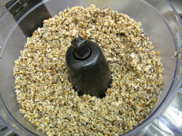 Caramel date nut bar ingredients in the food processor